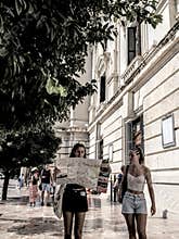 People going about their daily lives in the streets of the city of Valencia