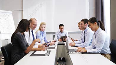 Smiling business people meeting in office