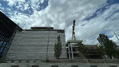 Amsterdam Zuida business district construction site with wrapped office building