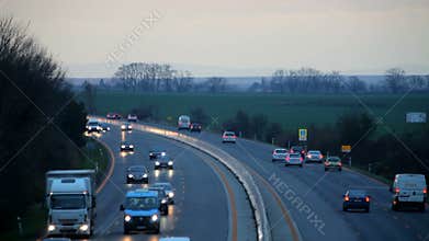 Highway with cars at sunset - Transportation