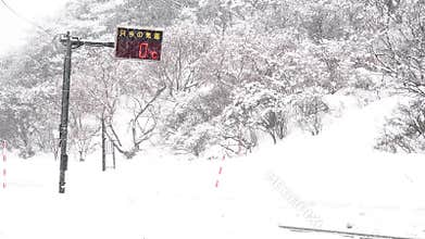 Heavy Snowfall on Winter Road in Yamagata Japan, 0°C