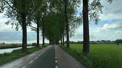 Driving on highway and rural roads near Amsterdam, Netherlands, with farmland and