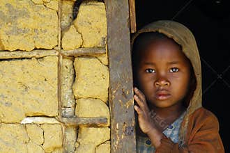 Shy and poor african girl with headkerchief