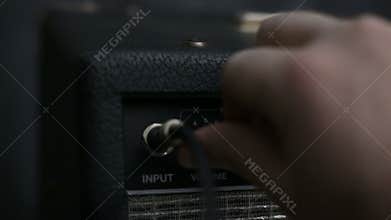 Powering On Guitar Amp and Turning Knobs