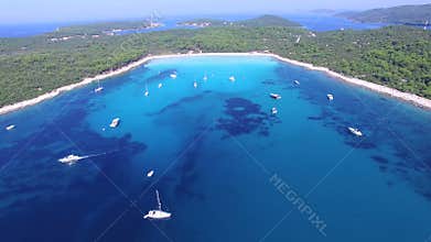 Flying over yachts and sailing boats at a Dalmatian bay
