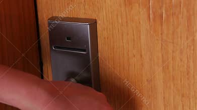 Woman opens the door with the key card