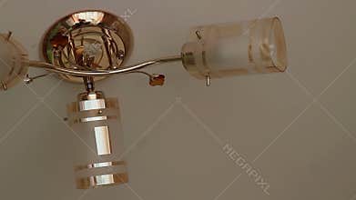 Beautiful kitchen chandelier on a cream background