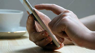 Female hand using mobile phone - Smartphone at home