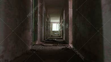 Running in the corridor in the abandoned house. Smooth and slow steady cam shot