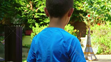 Boy starts paper airplane