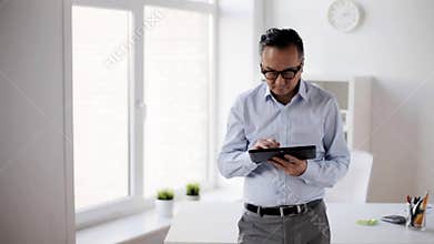 Businessman with tablet pc in office
