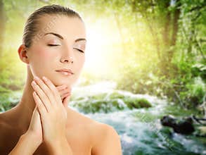 Woman applying organic cosmetics