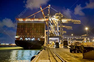 Cargo ship by night