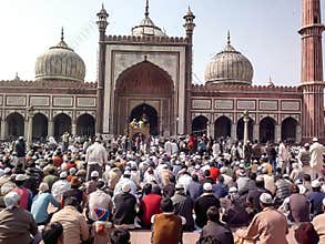 People gathering to offer Friday prayers
