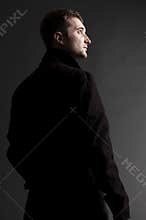 Handsome adult man looking up