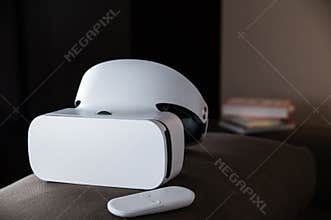 VR headset in the room with books behind it