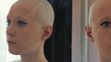 Sad woman in chemotherapy is concerned and worried