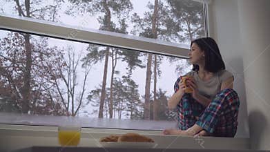 Lady drinking coffee in flat