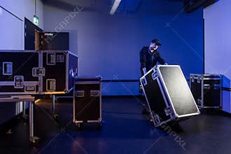 Roadie tipping over a flightcase
