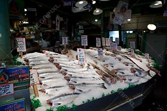 SEATTLE, WASHINGTON, USA - JAN 24th, 2017: Customers at Pike Place Fish Company wait to order fish at the famous seafood