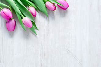 Tulips Flowers on wooden table for March 8, International Women