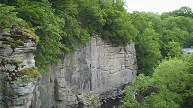4K Aerial footage. Fly in canyon. Climber on rock wall