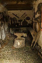 Old forge with rusty anvil.