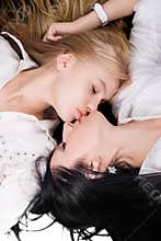 Portrait of the two kissing girlfriends