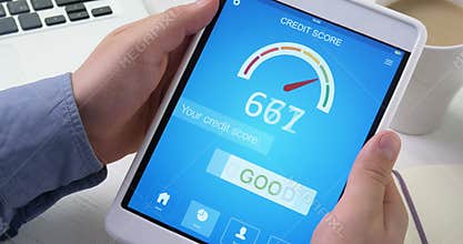 Checking good credit score on digital tablet