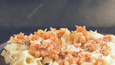 Eating plate of traditional Italian pasta .