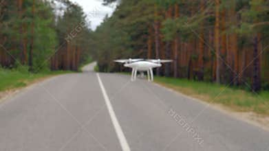 Slow motion shot drone flying along road.