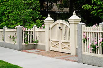 Elegant gate and fence on house entrance