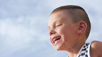 Happy boy laughing