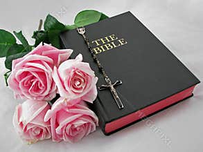 Bible with roses and rosary
