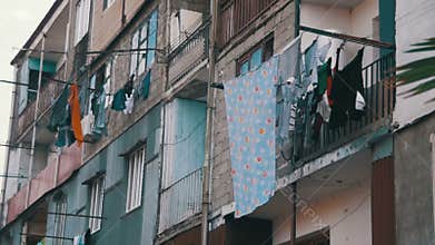 Clothes Weigh and Dry on a Rope in a Multi-Storey Building in a Poor Neighborhood of the City. Slow Motion