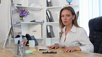 Beautiful young woman working in office. And does not find information