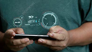 Close up shot hands of man using mobile smart phone with HUD head up display interface for futuristic cyber network connection con