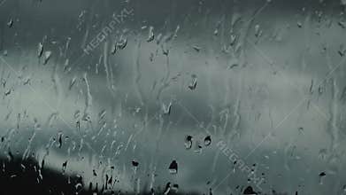 Streams of rain on the glass