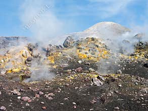 Smoking craters of Mount Etna on a sunny day
