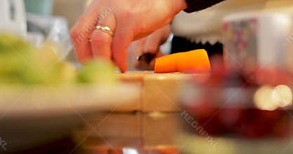 Cutting carrots in the kitchen