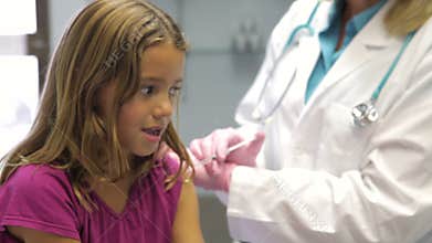 Child Having Injection In Doctor's Office
