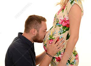 Man kissing pregnant belly