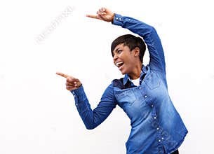 Cheerful young african american woman pointing fingers