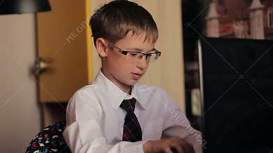 Boy 8 years old with glasses, a white shirt and
