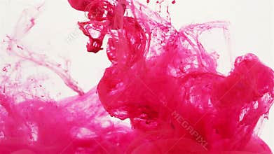 Magenta colored liquid slowly flowing