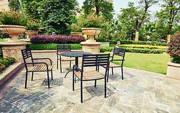 outdoor backyard patio in landscaping garden with furniture