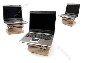 Laptop Computers on Piles of Books
