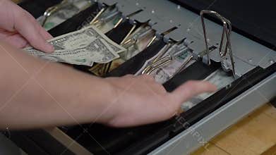 Cashier giving change after purchase