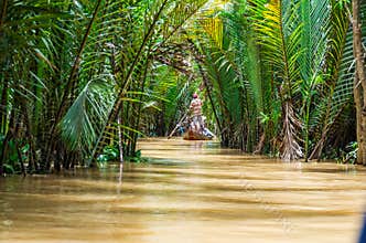 Vietnamese boatman in the Mekong Delta