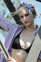 Woman in bra bikini, shirt and bandana
